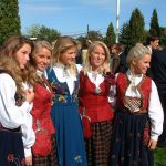 Young girls in different national costumes. Akershus, Norway.