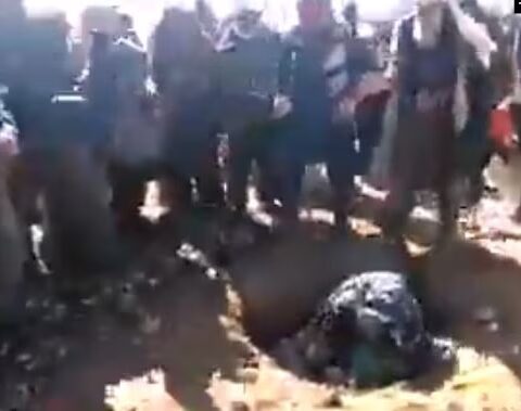 A grab from the video footage showing the stoning, which is alleged to have taken place in Afghanistan.